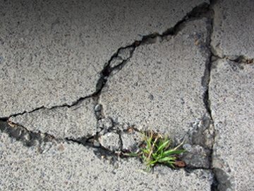 Cracked concrete in need of repair